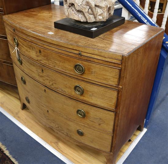 A Regency mahogany bow-fronted four-drawer chest with moulded caddy top 99cm.